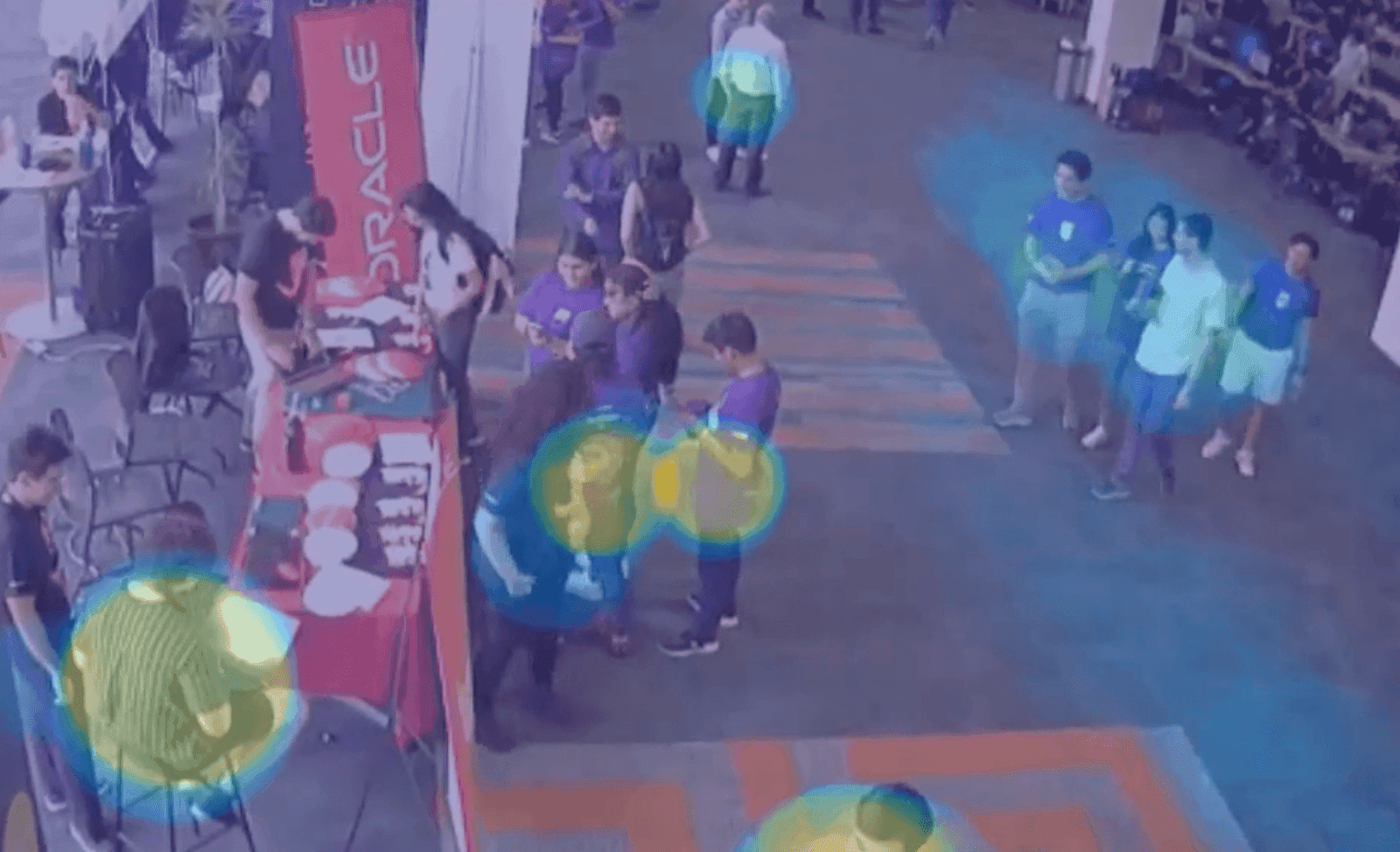 Overhead view of the hackathon floor next to the Oracle booth, with a heatmap of colored circles over the places where people stood the longest
